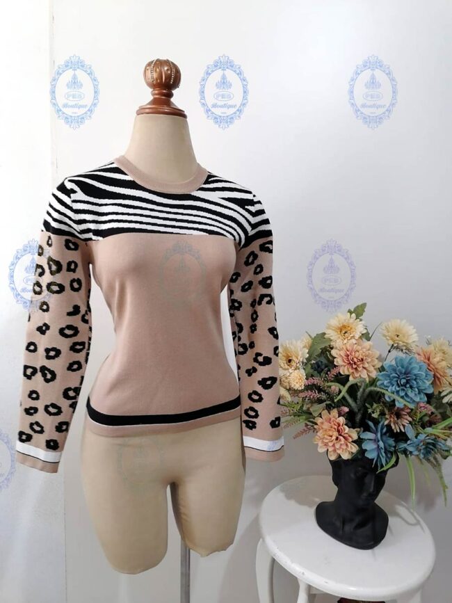 suéter mitad animal print